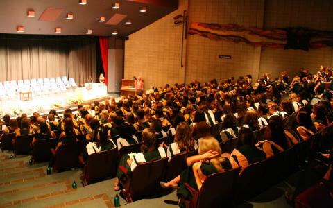 A group of graduating students filling the Wenjack Theatre