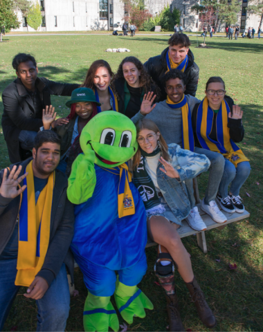 Toad - LEC Mascot surrounded with LEC students with scarfs