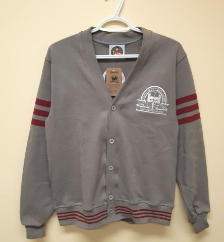 A grey button-up cardigan with a white Traill College logo in the upper left corner. There are a few maroon stripes on the upper sleeve and along the bottom hem.