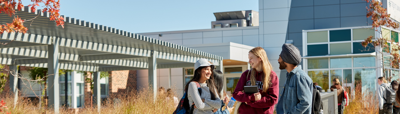 image of student in front of Trent University Durham campus