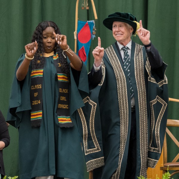 Chancellor Stephen Stohn dancing with a convocating student