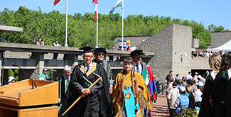 Professor David Newhouse leads faculty procession.