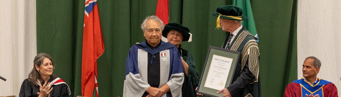 Harvey McCue receiving an honorary degree