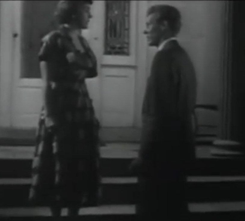 A black and white picture of a man and woman facing eachother 