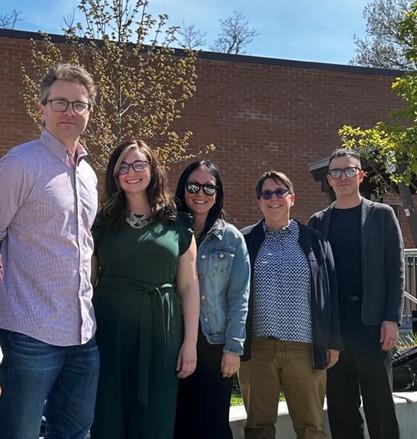 5 people posing for a picture outdoors at Traill College