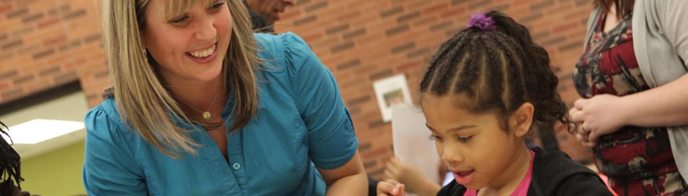 A Trent student volunteering with young children