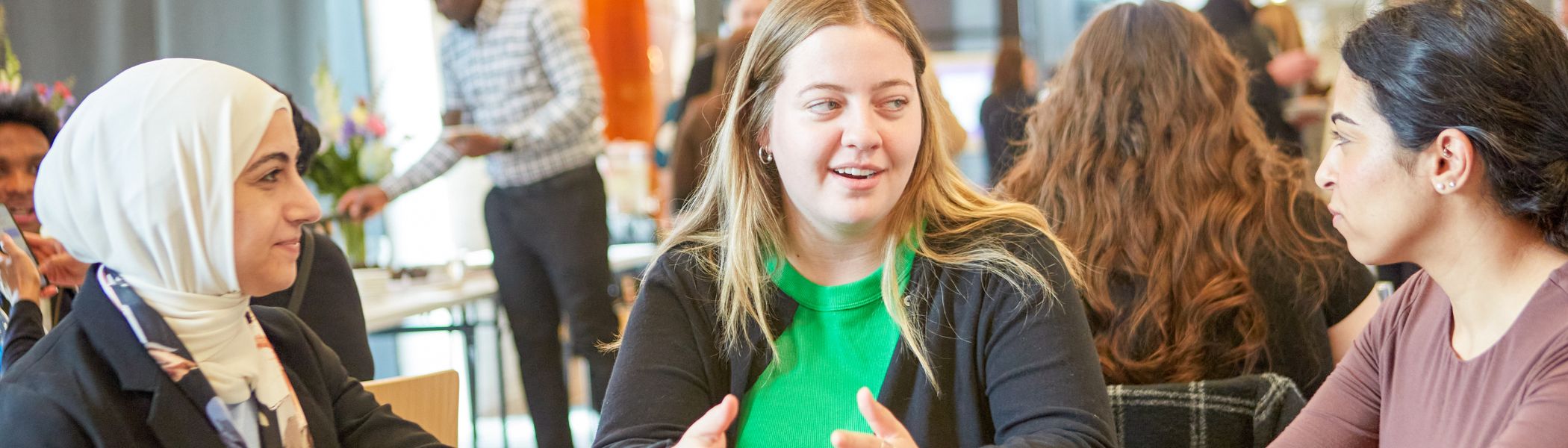 Faculty sitting at a table