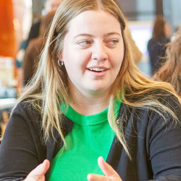 A faculty member talking to a student