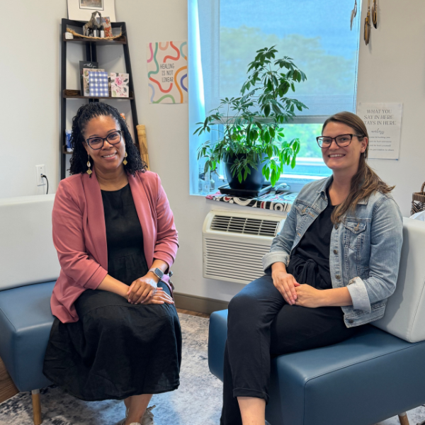 Two counsellors look to the camera