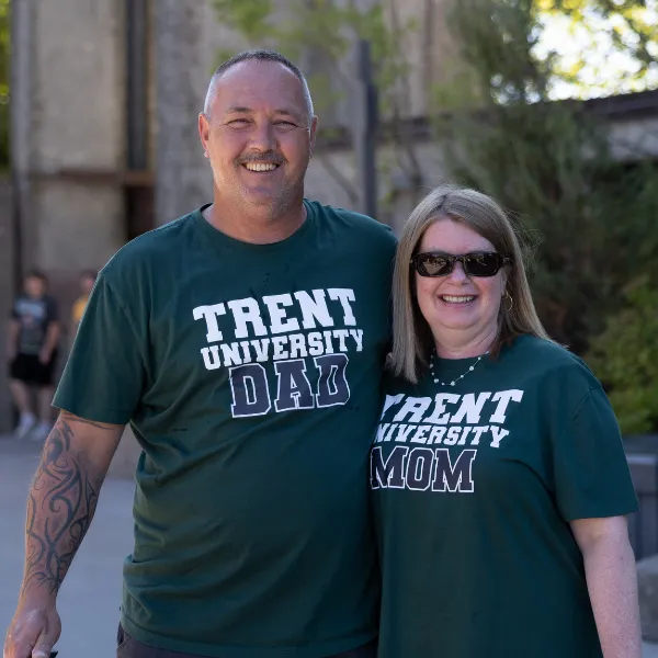 A Trent Dad and Mom wearing t-shirts showing their support for Trent