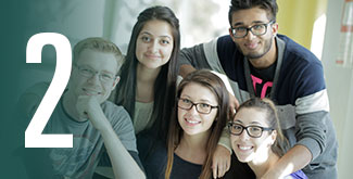 Group of students looking at the camera and posing for a group photo.