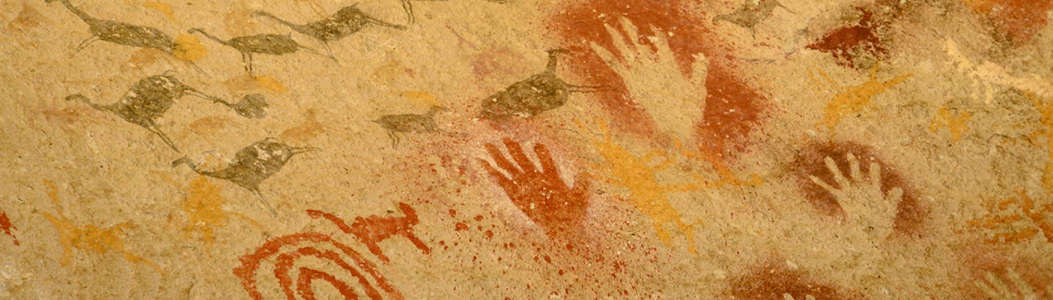 Native pictograph of handprints and deer