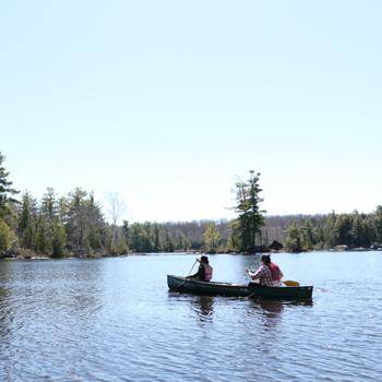 students canoeing in lovesick lake