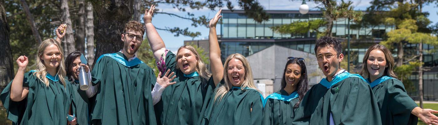 B.Ed. graduates smiling and posing after graduation