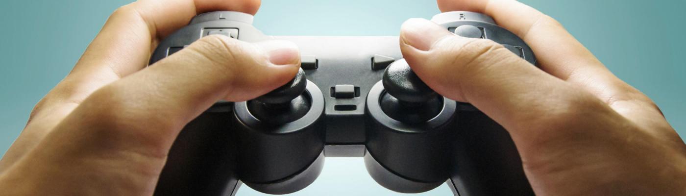 Image of hands grasping a play station controller