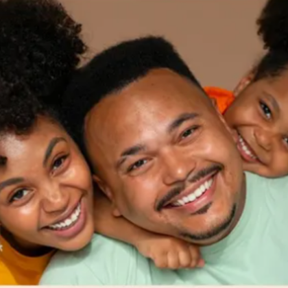 Three people smiling at camera