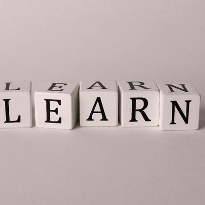 An image with white block letters which spell out "learn"