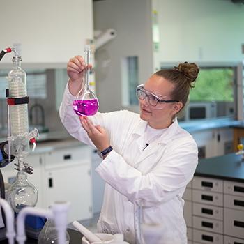 A chemistry student in a lab