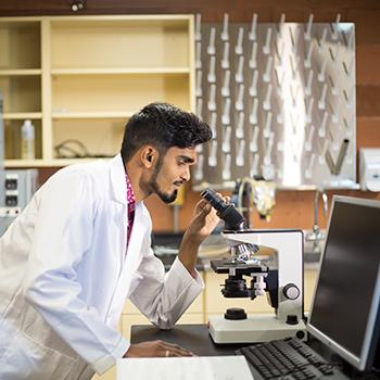 Trent University student working in a Chemistry lab.