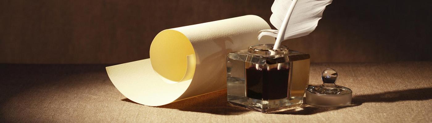 A loose leaf of paper with ink and pen