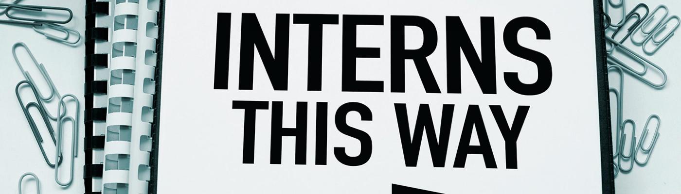 Interns This Way sign