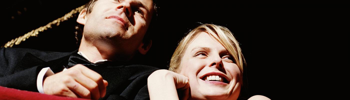 Man and a woman watching a performance