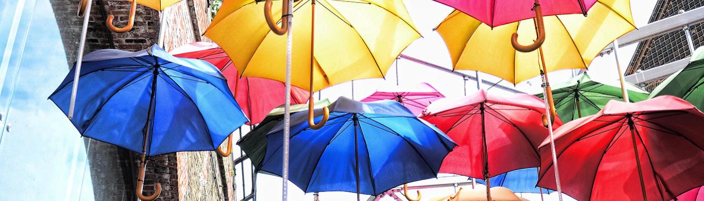 Colourful umbrellas in an alley