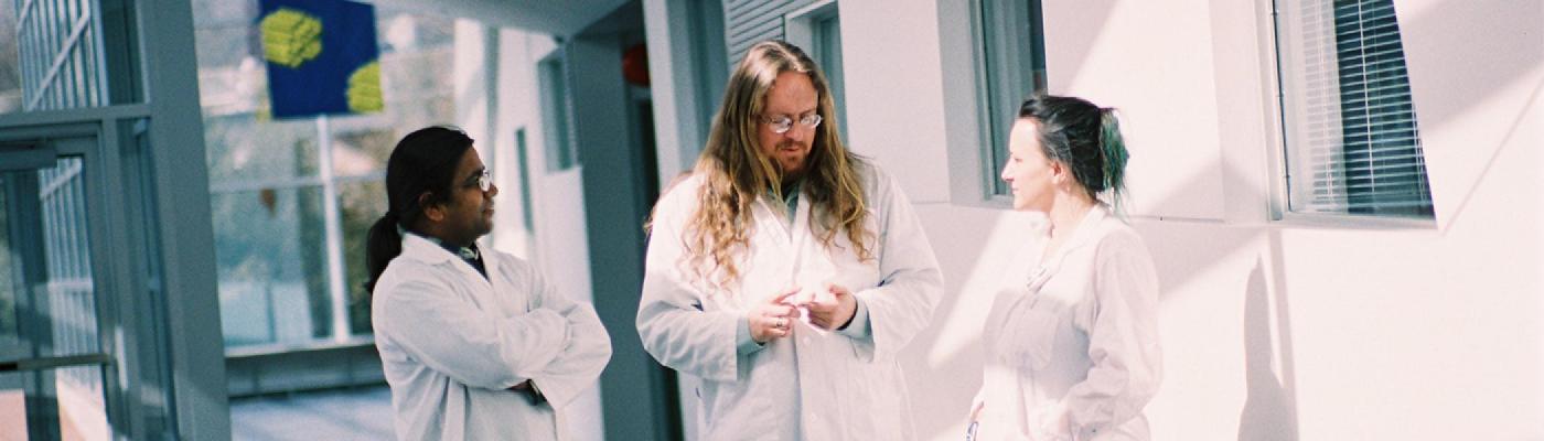 Chemistry Professor with students in hallway of Chemical Sciences Building
