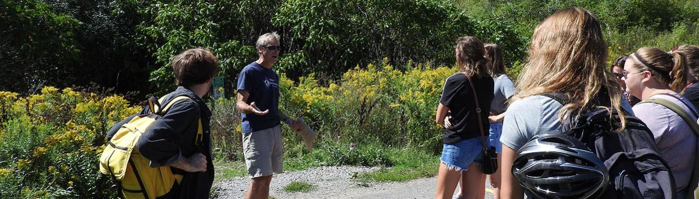 Professor speaks to students outside
