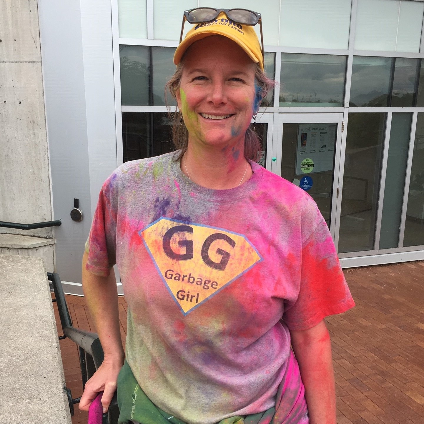 Photo of Laurie Westaway smiling in front of the Environmental Science Building at Trent University