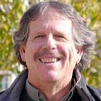 person with pale skin and light brown hair and mustache