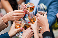 Large banquet room with a head table and a full audience watching speeches