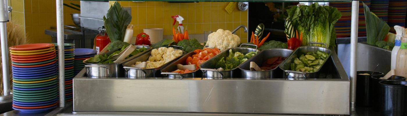 a tray full of food filled with vegetables