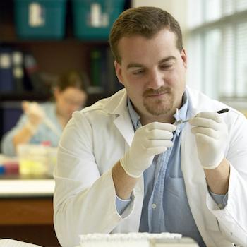 person wearing a lab coat in a lab
