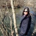 Deborah McGregor standing by a river