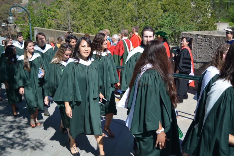 Convocation students walking to graduate