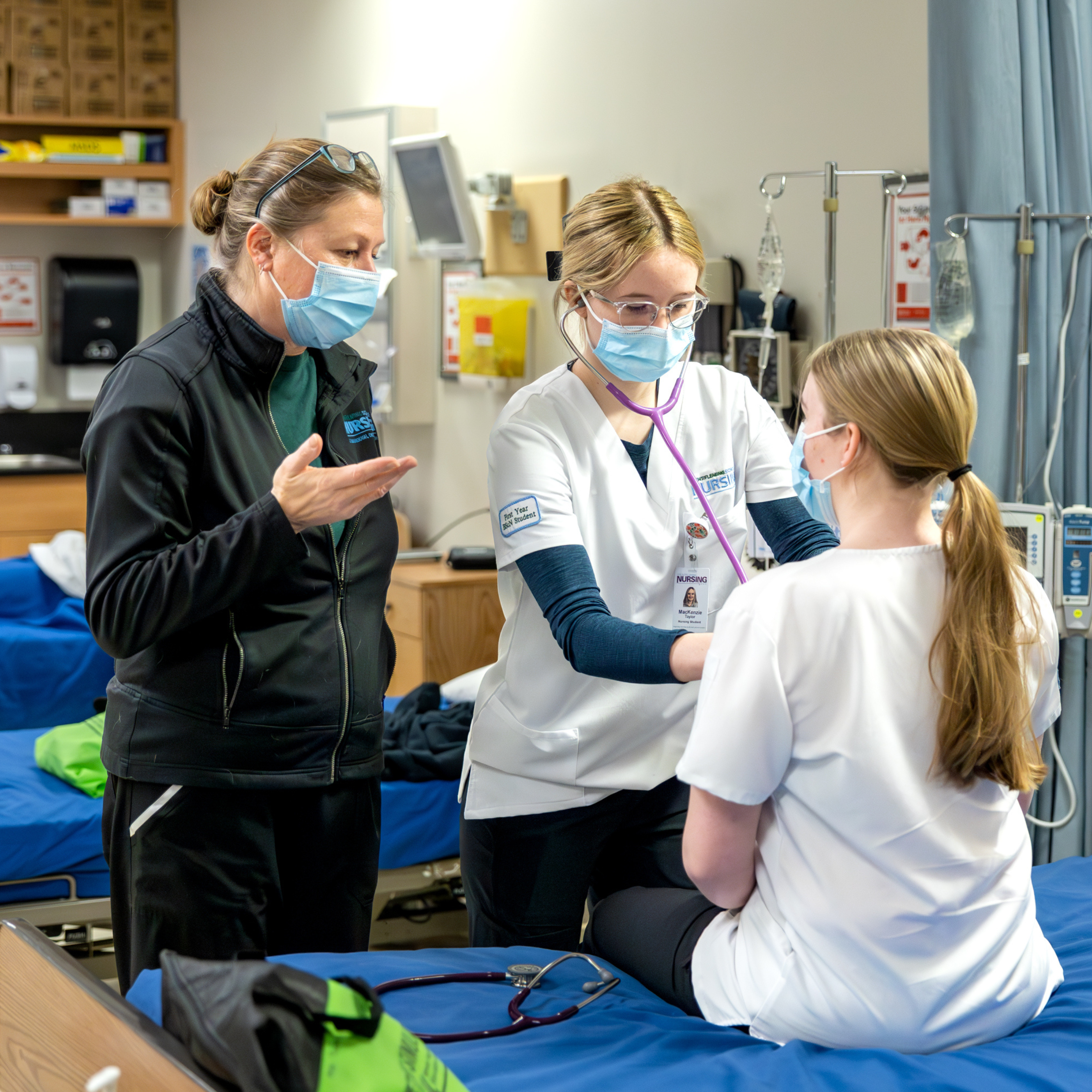 Nursing students with professor learning