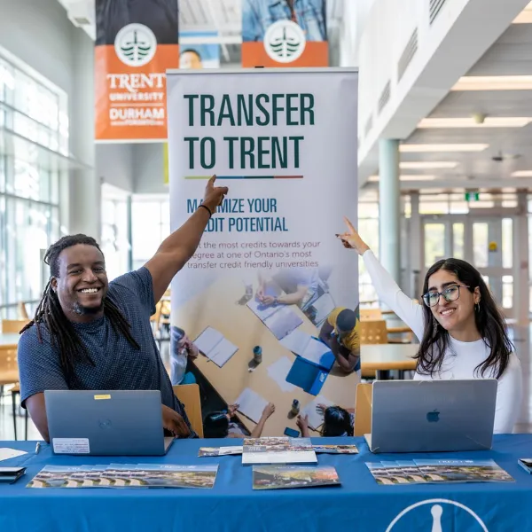 Advisors point to a sign that says 'Transfer to Trent'
