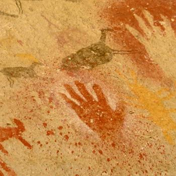Native pictograph of handprints and deer