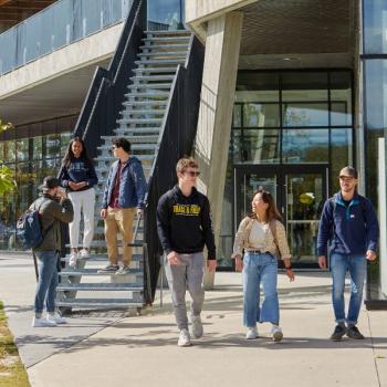 Students walking together across the Symons Campus in Peterborough