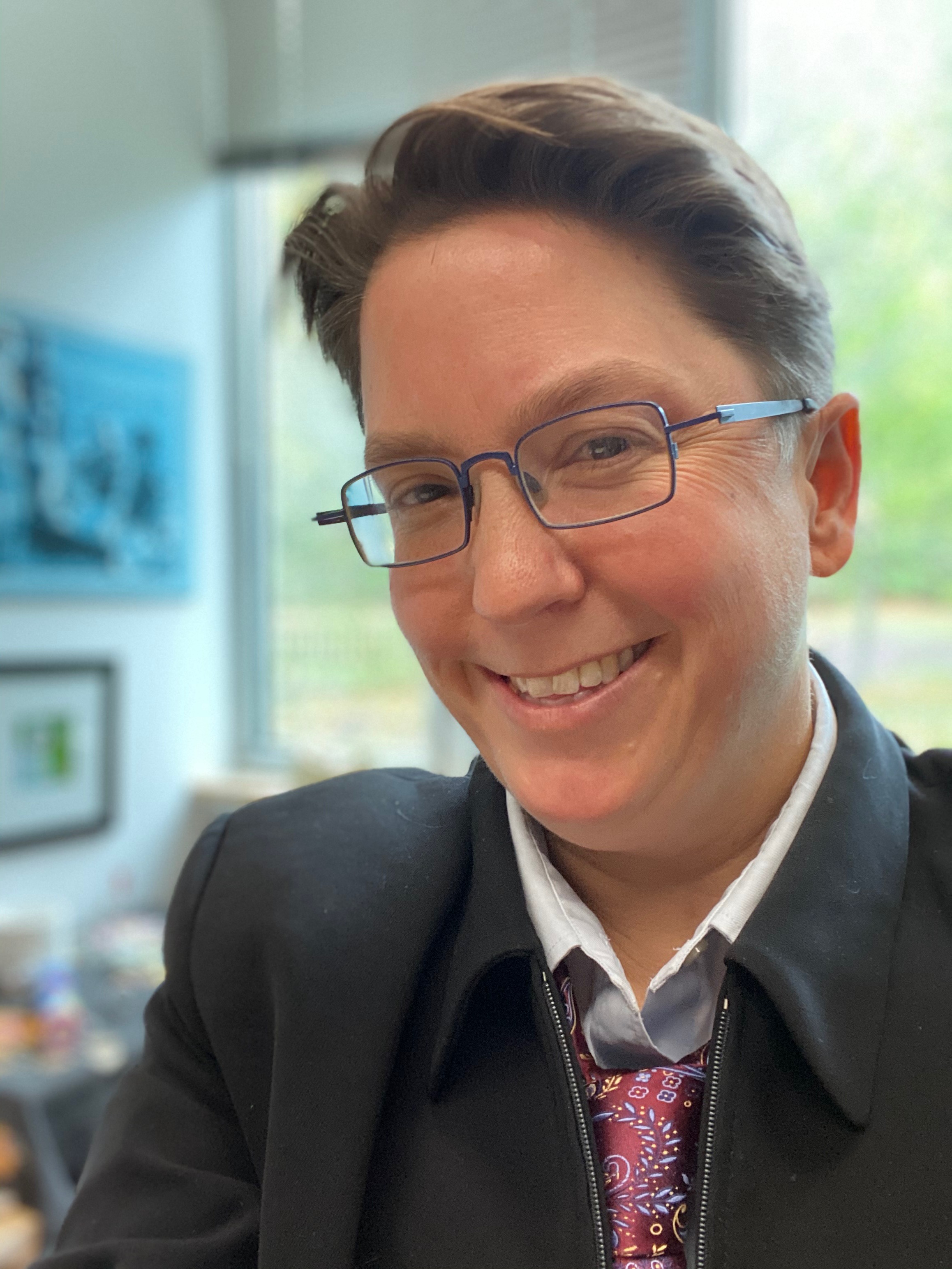 Karleen Pendleton-Jiminez smiling against a light green and white background