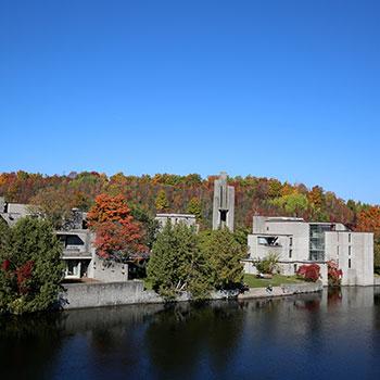 Champlain College in the fall surrounded by colourful trees