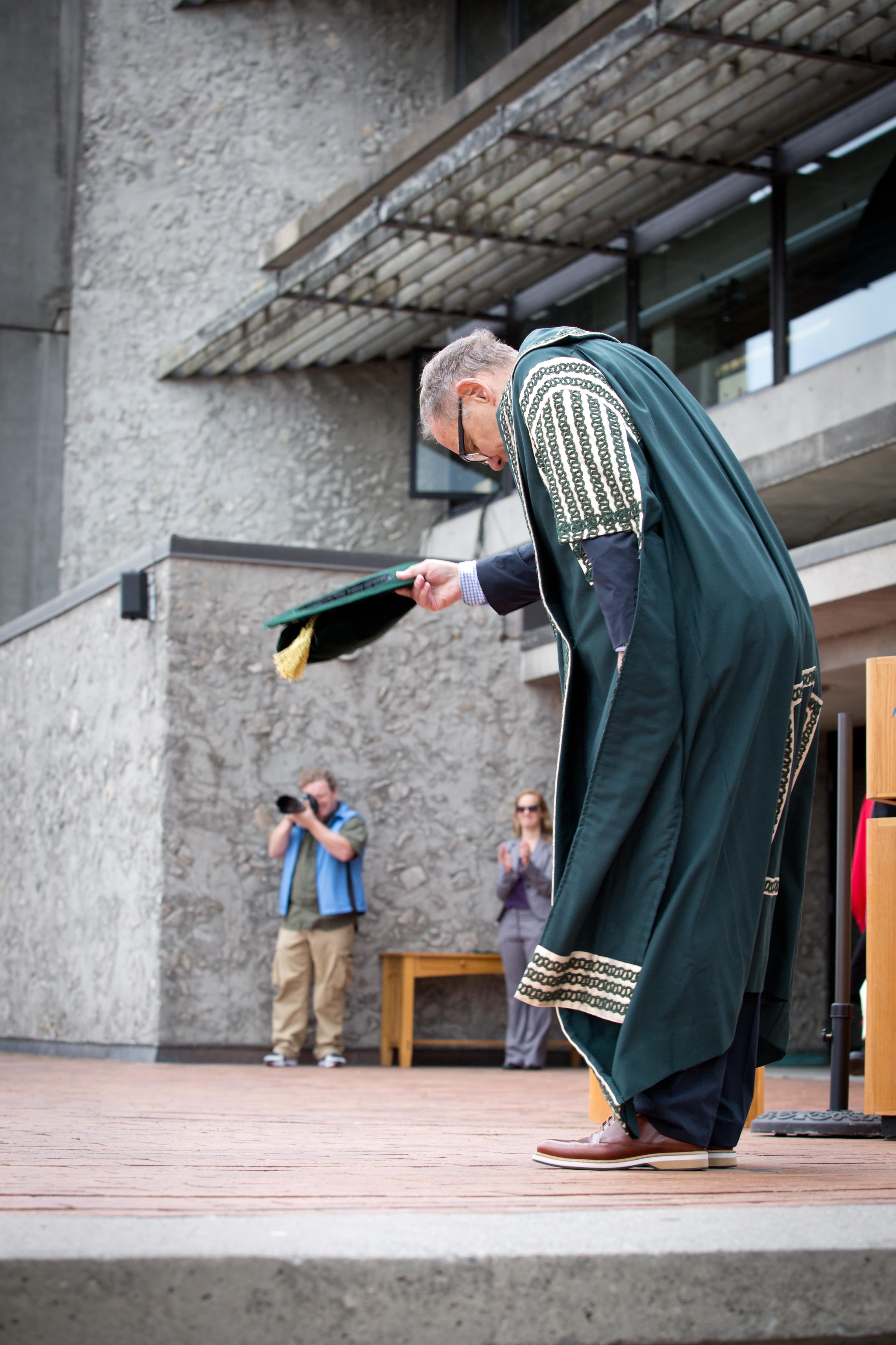 Chancellor Don Tapscott tips his hat at convocation.