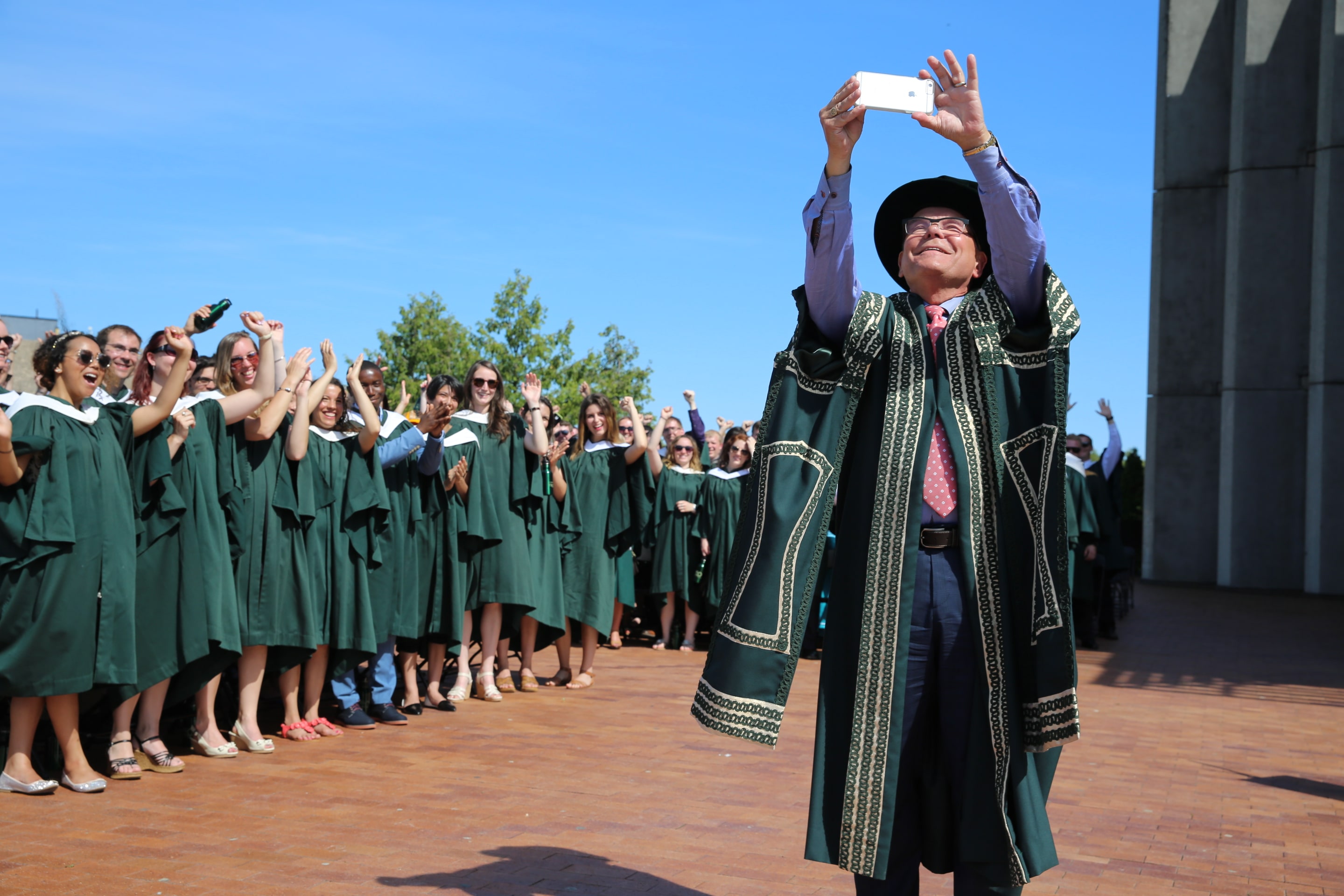 Don Tapscott takes a selfie at convocation
