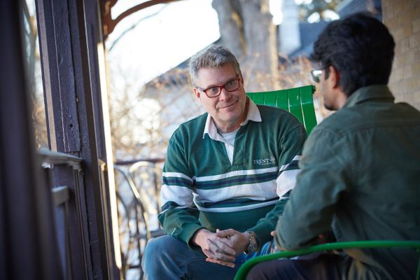 student talking with faculty member