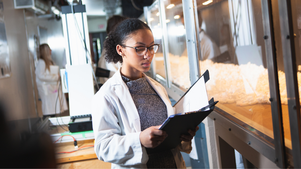 student in wind funnel lab