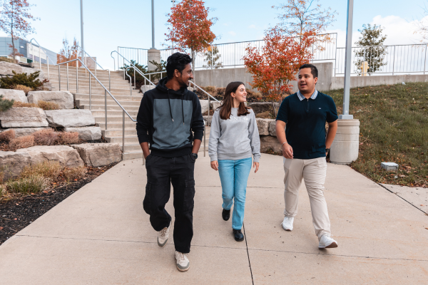 three students walking outside