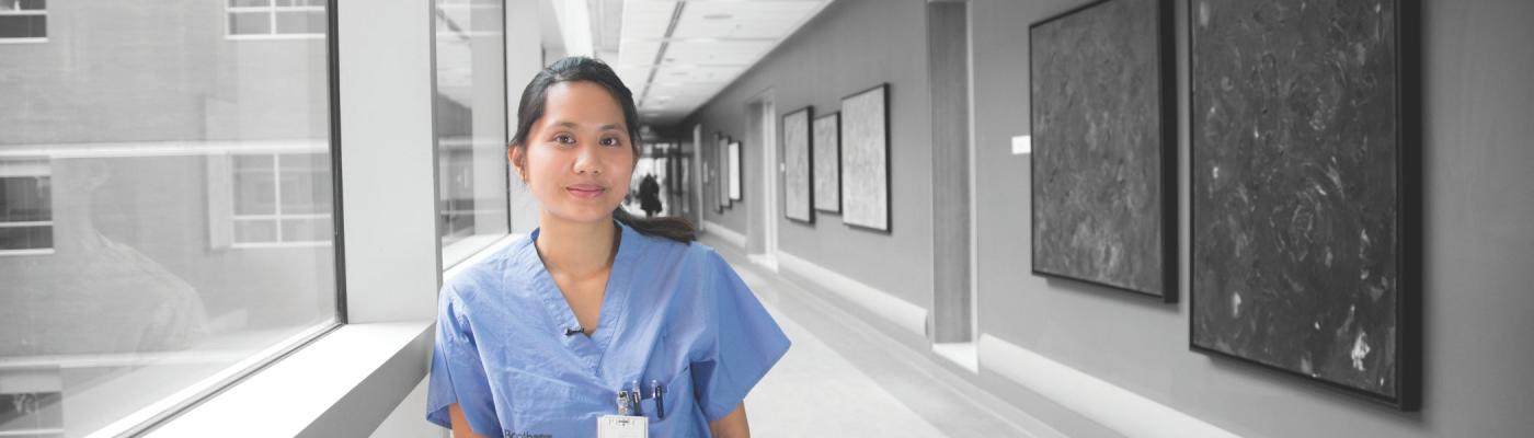 A nurse standing in a hallway