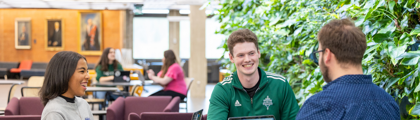 students talking in the bata library