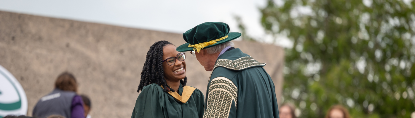 graduate student shaking hands